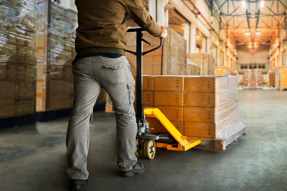 Worker using pallet mover that was financed